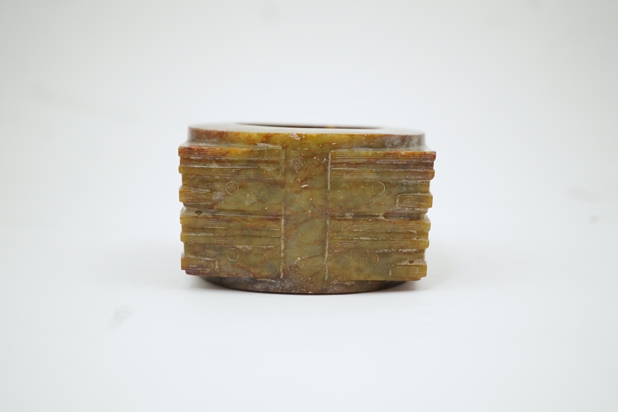 Four Chinese archaistic hardstone or burnt jade cong or cylinders